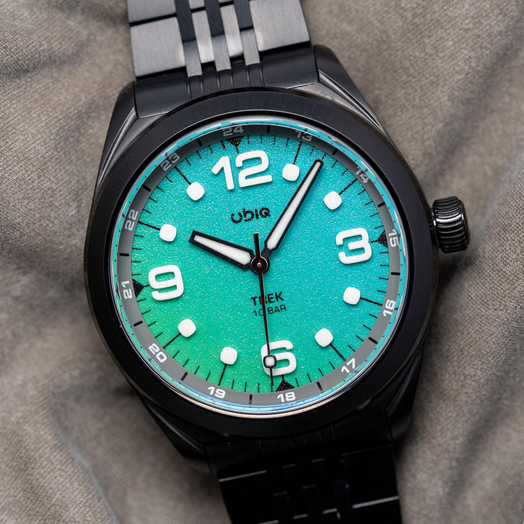2025 UBIQ TREK CoralGlow Dial Mechaquartz Titanium 38mm