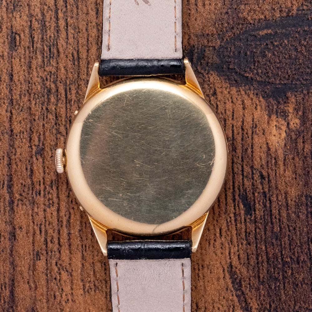 Solid gold deals movado watch