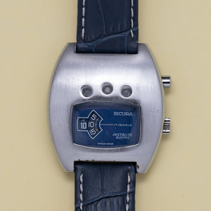 1970s Sicura Instalite Electric Jump Hour Blue Dial