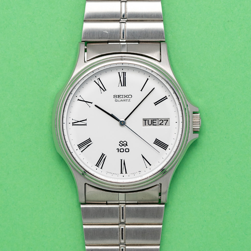 Seiko sq100 quartz on sale watch